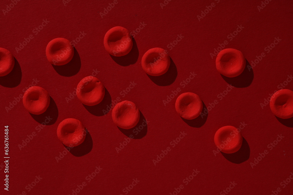 Red blood cells model on red background Red blood cells model on red background