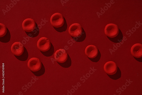 Red blood cells model on red background