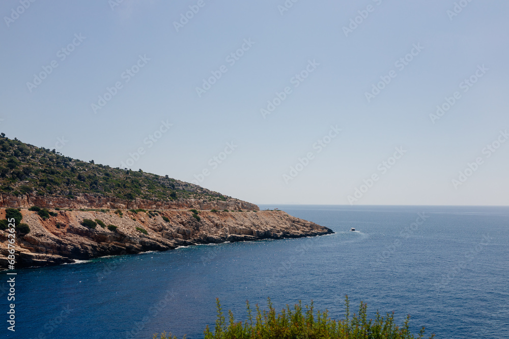 Beautiful seascape on a sunny day In Turkey. The Mediterranean Sea, surrounded by mountains, with picturesque islands on a summer day. Summer background with blue ocean