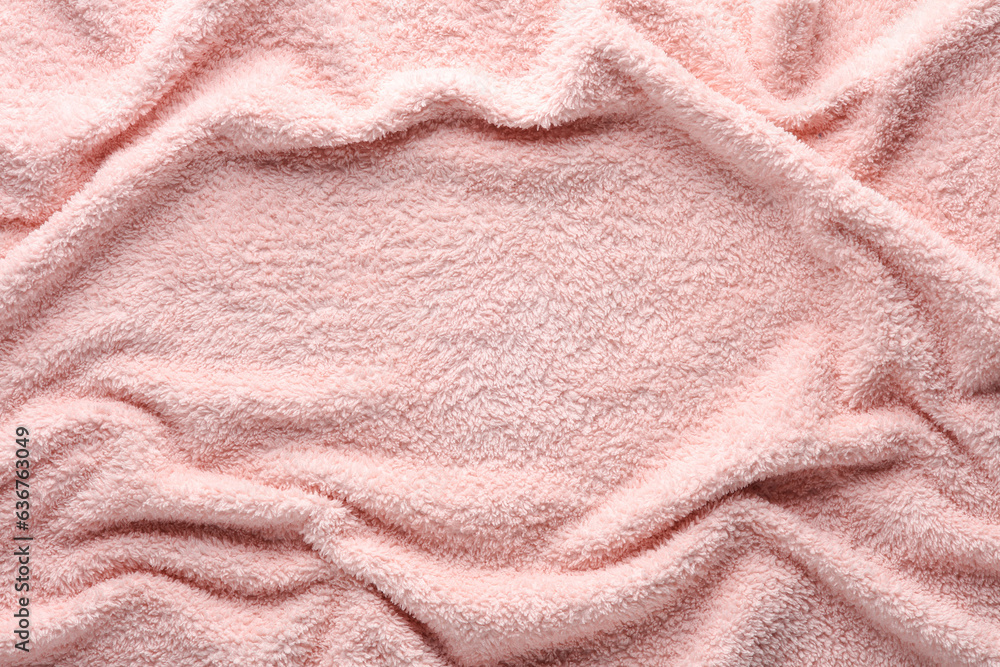Texture of wavy pink fleecy towel with copy space