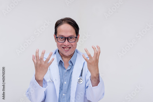 Photos An evil, corrupt and mad doctor with his hands up revealing his fiendish plans