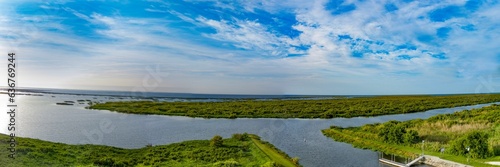 Fototapeta Naklejka Na Ścianę i Meble -  View of Lake Okeechobee surrounded by lush greenery in Florida, the United States