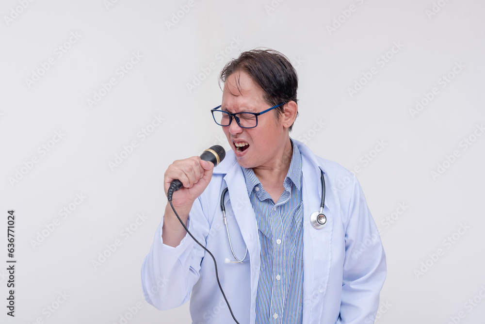 A family doctor singing with a microphone during a karaoke session after work. Of asian descent, middle aged male in his 40s. Isolated on a white background. A family doctor singing with a microphone during a karaoke session after work. Of asian descent, middle aged male in his 40s. Isolated on a white background.