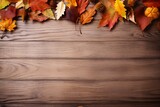 Brown wooden background with autumn leaves border