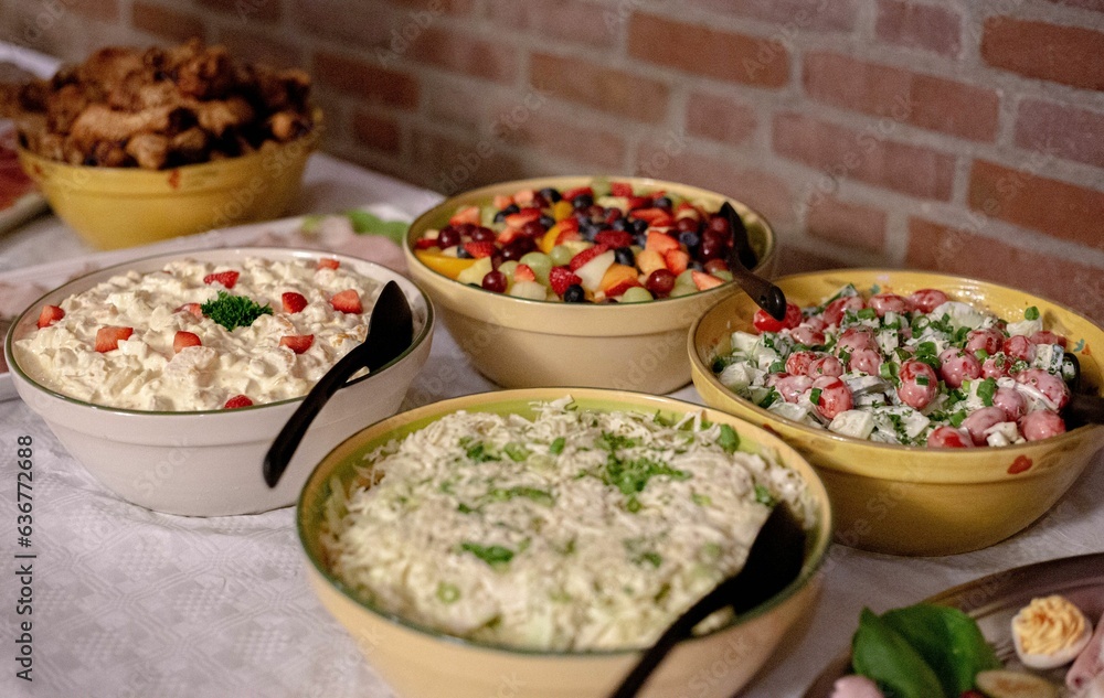 Closeup of the delicious-looking colorful salads with many healthy ingredients on the table Closeup of the delicious-looking colorful salads with many healthy ingredients on the table