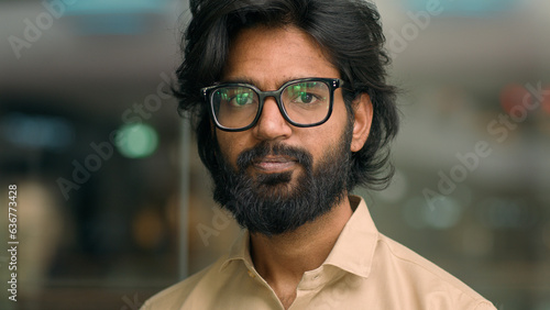 Close up male business portrait headshot serious bearded Arabian Hispanic Indian man corporate agent company worker businessman guy in glasses executive entrepreneur employer manager looking at camera