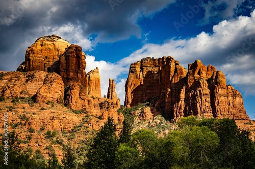 Majestic landscape view of rock formations of Cathedral rock in Arizona surrounded by lush foliage