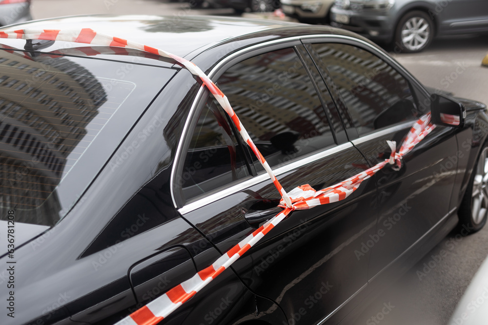 the car is wrapped in a striped tape