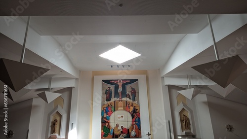 The window in the center of the ceiling in the church and the design of the church interior inside the Catholic church
