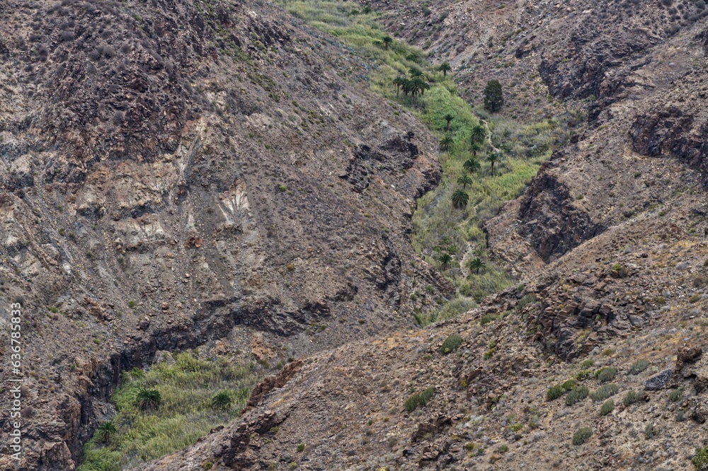 Obraz premium Scenic view of barren rock formations in a canyon