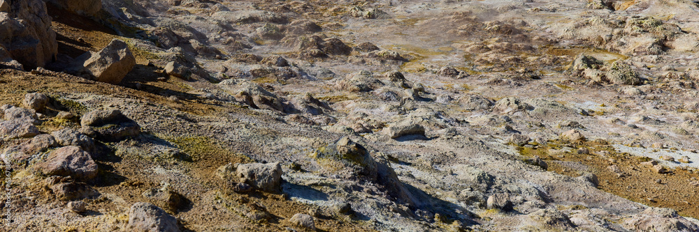 Obraz premium Hverir, Iceland. A surreal, bare orangy-red, geothermal area at the foot of Namafjall. Full of fumaroles, mud pools, steam vents. It's on Route 1. It is also called Namaskard Hverir.