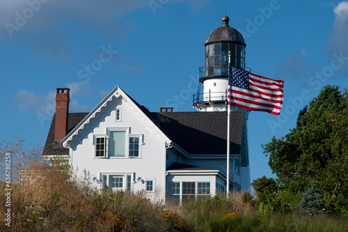 American Flag Waves in Front of Cape Elizabeth Lighthouse in Maine