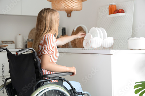 Young woman in wheelchair t...