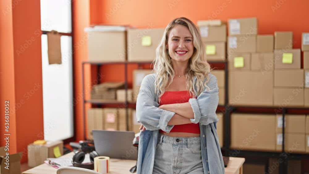 Young blonde woman ecommerce business worker standing with arms crossed gesture at office Young blonde woman ecommerce business worker standing with arms crossed gesture at office