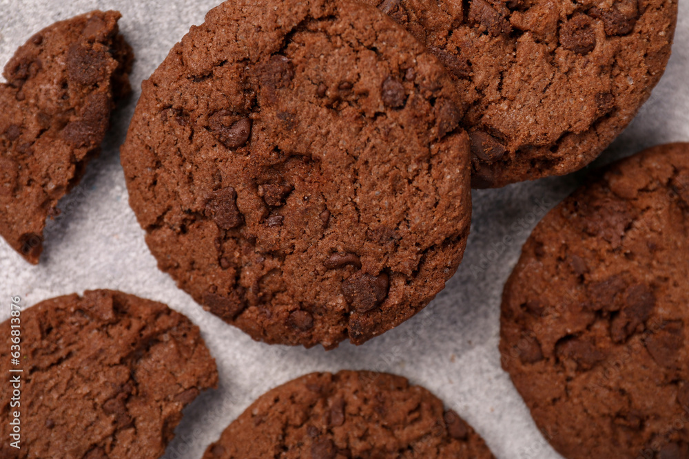 Tasty chocolate cookies on light grey textured table, closeup Tasty chocolate cookies on light grey textured table, closeup