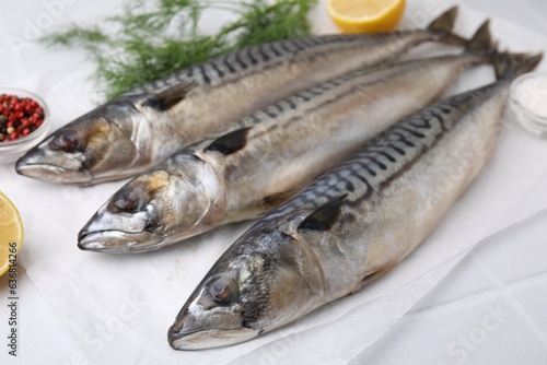 Tasty salted mackerels on white table, closeup