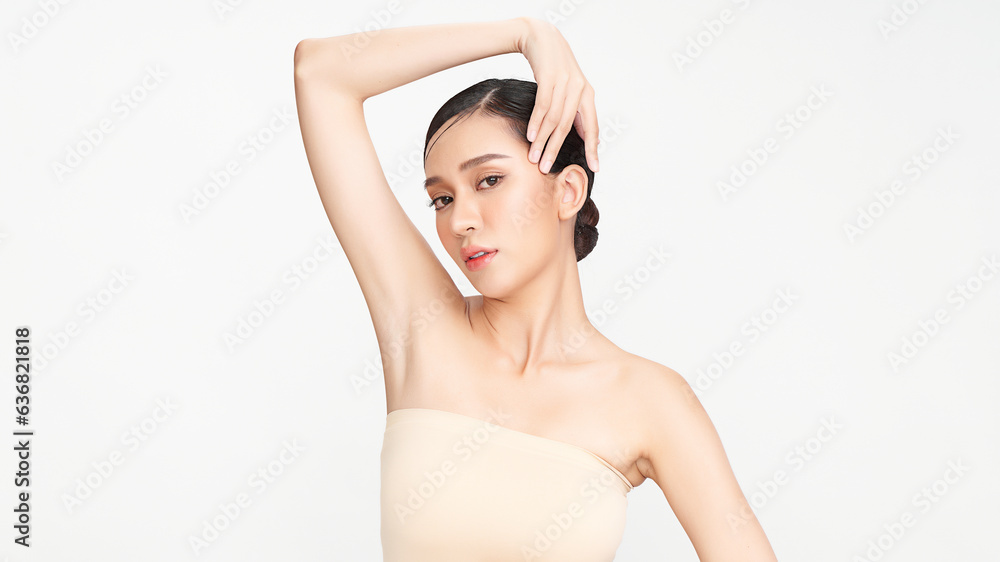Beautiful Young woman lifting hands up to show off clean and hygienic armpits or underarms on white background, Smooth armpit cleanliness and protection concept Beautiful Young woman lifting hands up to show off clean and hygienic armpits or underarms on white background, Smooth armpit cleanliness and protection concept