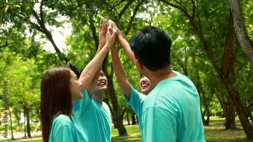 Happiness group of men and women teenage students environmental volunteers planting forests unity and strength join hands raise hands work volunteers youth volunteers do good deeds for society. Happiness group of men and women teenage students environmental volunteers planting forests unity and strength join hands raise hands work volunteers youth volunteers do good deeds for society.