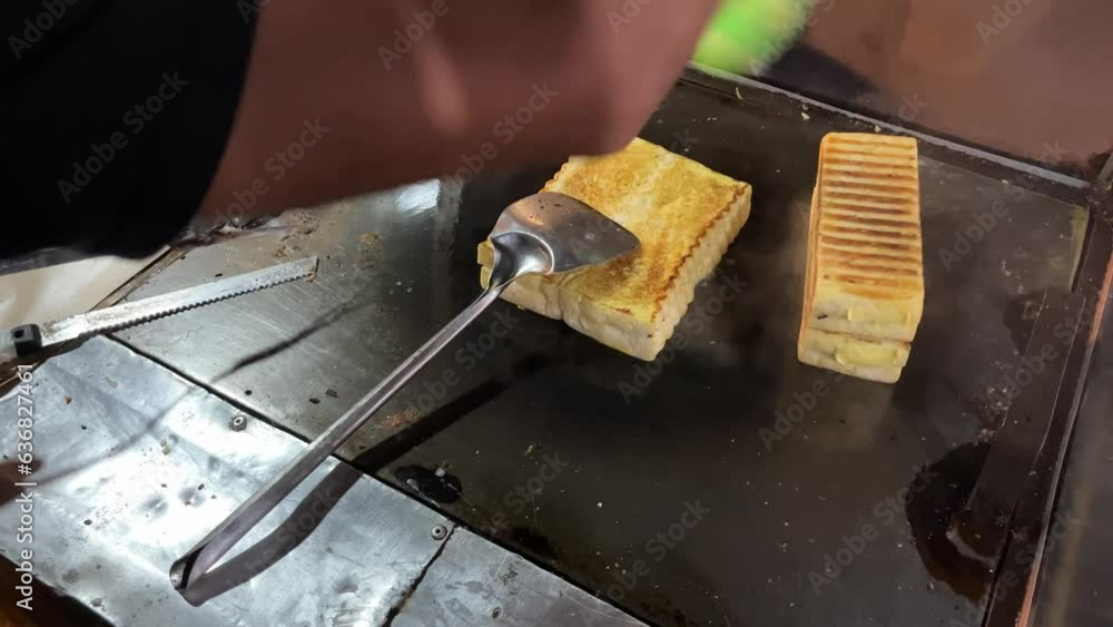 Street food booth selling Roti Bakar Bandung which is Indonesian toast ...