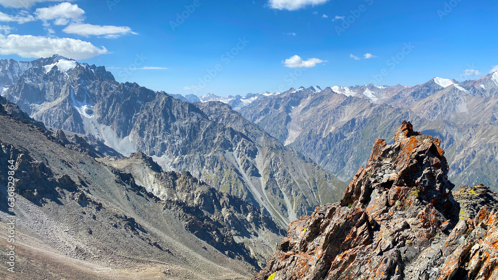 Mountains of Kyrgyzstan, Asia. View from the height of a beautiful mountain valley. Mountain summer landscape. Climbing Komsomolets Peak, Ala-Archa National Park