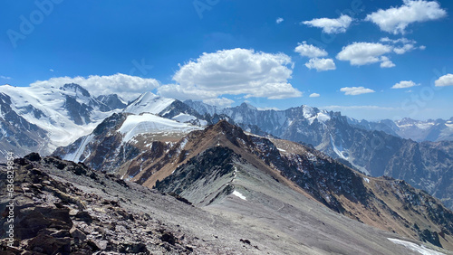 Beautiful mountain summer landscape. Amazing view of the snow-capped mountains around Komsomolets Peak, Ala-Archa National Park, Kyrgyzstan. photo