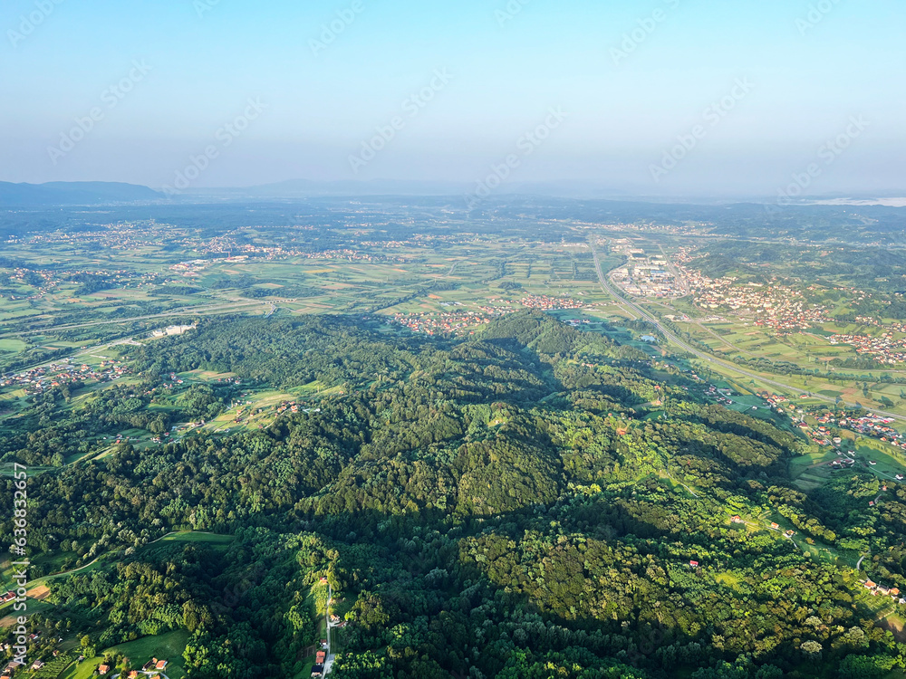 Fototapeta premium View of forests, fields, villages and Zagorje hills, during a panoramic balloon flight over Croatian Zagorje - Croatia (Panoramski let balonom iznad Hrvatskog zagorja - Hrvatska)