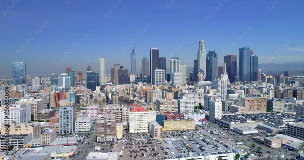 Aerial Forward Shot Of City Against Blue Sky, Drone Flying Over Cityscape - Los Angeles, California Aerial Forward Shot Of City Against Blue Sky, Drone Flying Over Cityscape - Los Angeles, California