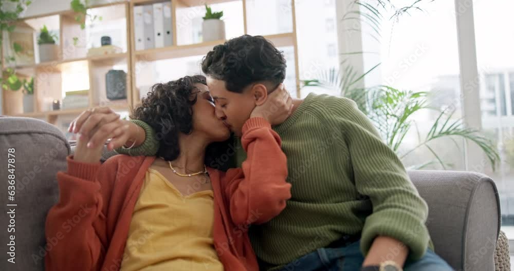 Love, home and lesbian couple kiss, smile or care for bisexual, non binary or homosexual gen z people on living room sofa. LGBTQ, connection and gay women bonding, happy and enjoy relax time together Love, home and lesbian couple kiss, smile or care for bisexual, non binary or homosexual gen z people on living room sofa. LGBTQ, connection and gay women bonding, happy and enjoy relax time together