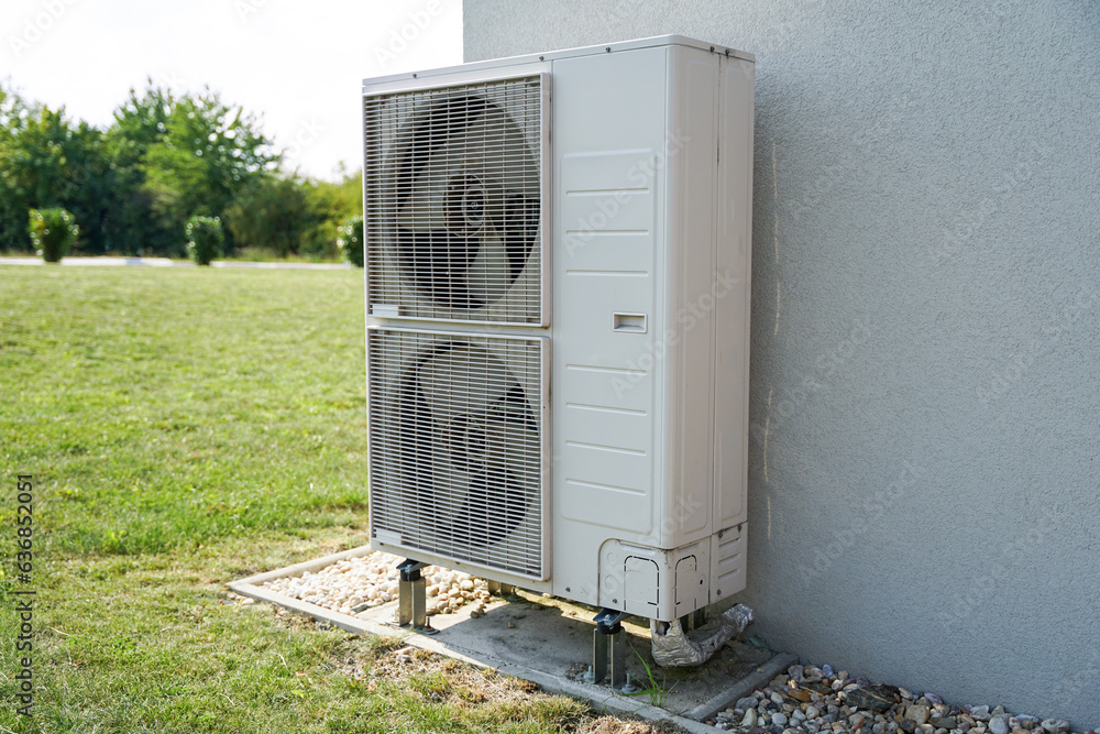 Powerful air conditioning or heat pump outdoor unit with two fans, eco green energy house of future concept