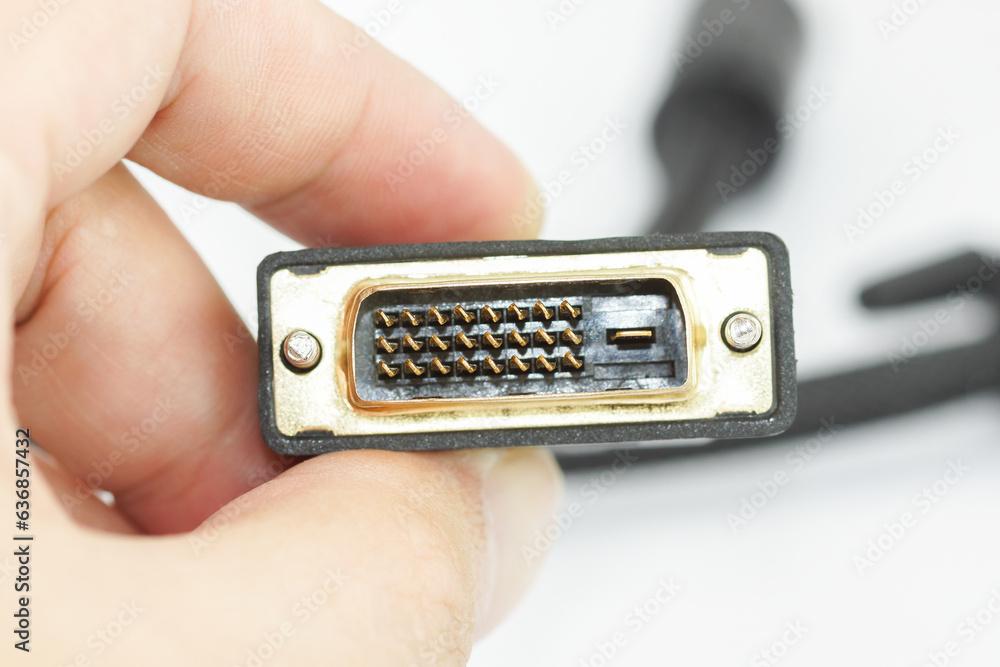 hand holding a DVI connection port close-up on white background, PC Hardware hand holding a DVI connection port close-up on white background, PC Hardware