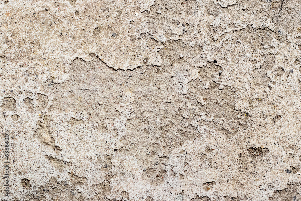Fototapeta premium The texture of the plastered wall, from which the plaster fell off in some places