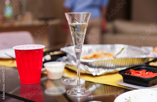 Plastic cups at a lively party embody celebratory spirit, casual socializing, and youthful exuberance, symbolizing carefree moments and camaraderie