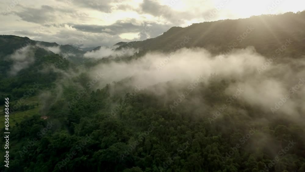 A breathtaking aerial scenery of lush green tropical rainforest mountain. The majestic Doi Phuka Mountain Reserved National Park adorned with a canopy of rain clouds, nestled in Northern Thailand A breathtaking aerial scenery of lush green tropical rainforest mountain. The majestic Doi Phuka Mountain Reserved National Park adorned with a canopy of rain clouds, nestled in Northern Thailand