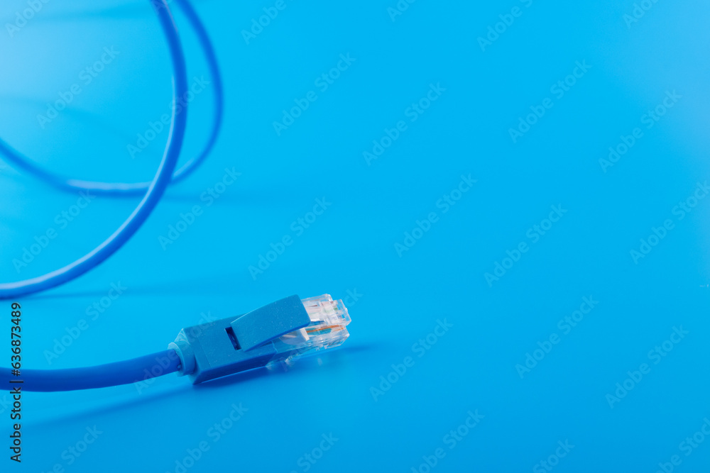 router cable, Patchcord, LAN cable for high speed internet, blue background router cable, Patchcord, LAN cable for high speed internet, blue background