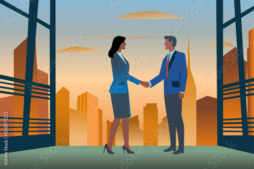 woman and man standing shaking hands to close a business deal. In the background buildings and sky at sunset