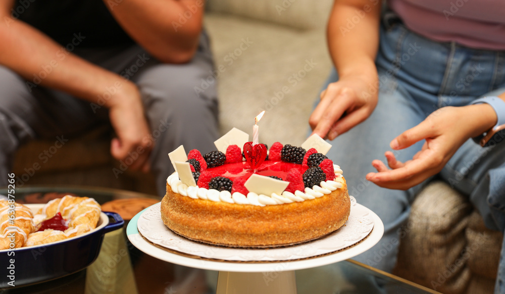 Hands and utensils gather around, embracing the communal spirit of a potluck dinner. Symbolizing unity, sharing, and indulgence as they enjoy a variety of desserts