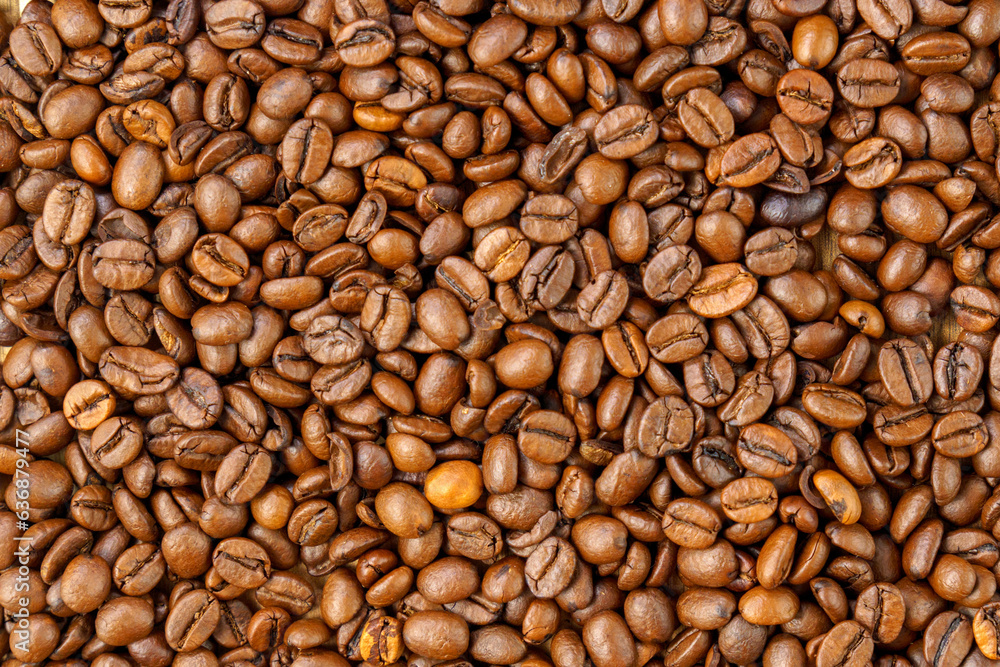 Roasted coffee bean. Masses of falling coffee beans close up. Texture Roasted coffee bean. Masses of falling coffee beans close up. Texture