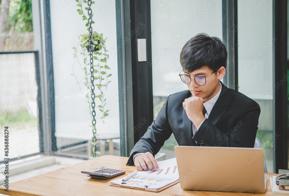 Businessman working online via video call in team meeting with the charging of graphs for analysis, conceptual analysis and business planning Businessman working online via video call in team meeting with the charging of graphs for analysis, conceptual analysis and business planning