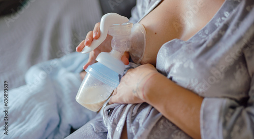 A mom expressing breast milk with a breast pump