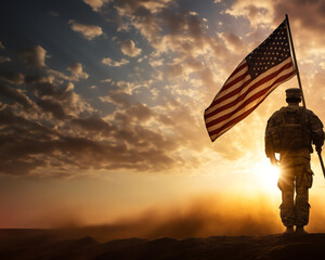 Soldier and USA flag on sunrise background . Veterans Day.