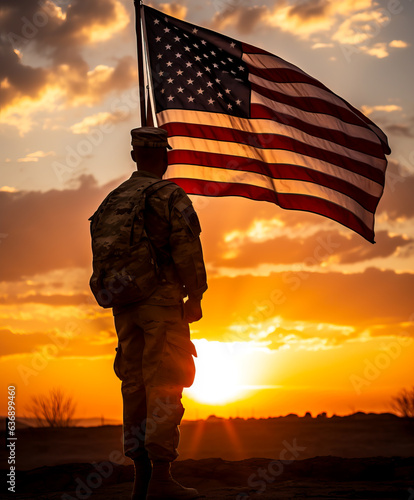 Soldier and USA flag on sunrise background . Veterans Day.