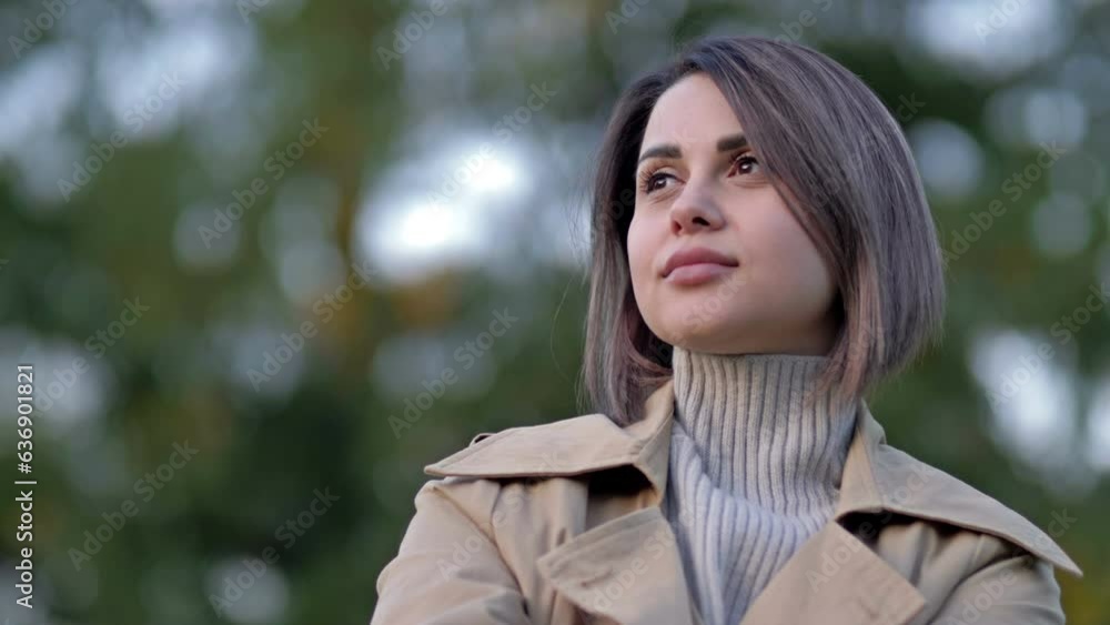 Portrait of young woman in spring park. Portrait of young woman in spring park.