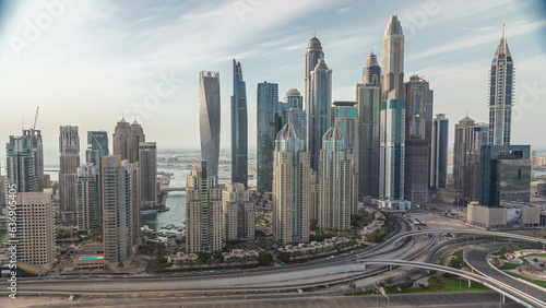 Skyscrapers of Dubai Marina near intersection on Sheikh Zayed Road with highest residential buildings all day timelapse © neiezhmakov