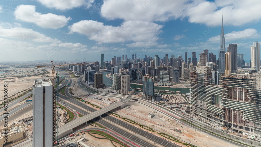 Obraz premium Panorama showing skyline of Dubai with business bay and downtown district timelapse.