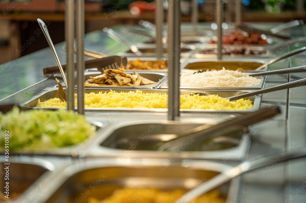 Fototapeta premium Asian food buffet in restaurant multiple food dishes and salad.