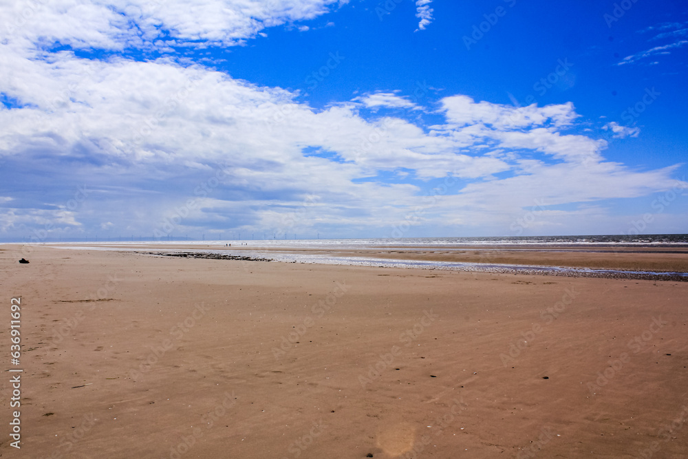 The view of the Formby Beach (Victoria Road Beach) or Formby Dunes in Liverpool, UK at sunny day. City in Merseyside county of North West England. Including the famous sand dunes. Nature, travel scene The view of the Formby Beach (Victoria Road Beach) or Formby Dunes in Liverpool, UK at sunny day. City in Merseyside county of North West England. Including the famous sand dunes. Nature, travel scene