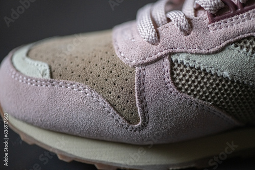 Fragment of original suede sports sneakers.
