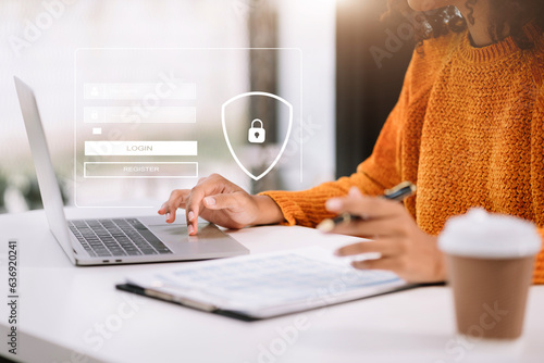 Businessman typing login and password in the concept of cyber security, information security, data protection, and encryption for secure access to user's personal information. photo