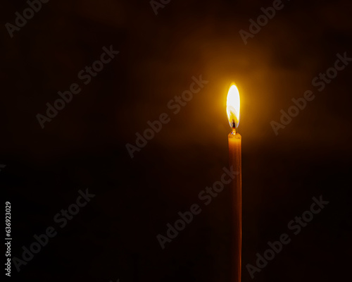 candle in the church, Candle on a dark background, Christian church, prayer in the temple, melted candles, Candle flame in the dark