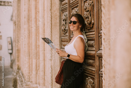 Female tourist with city ma...